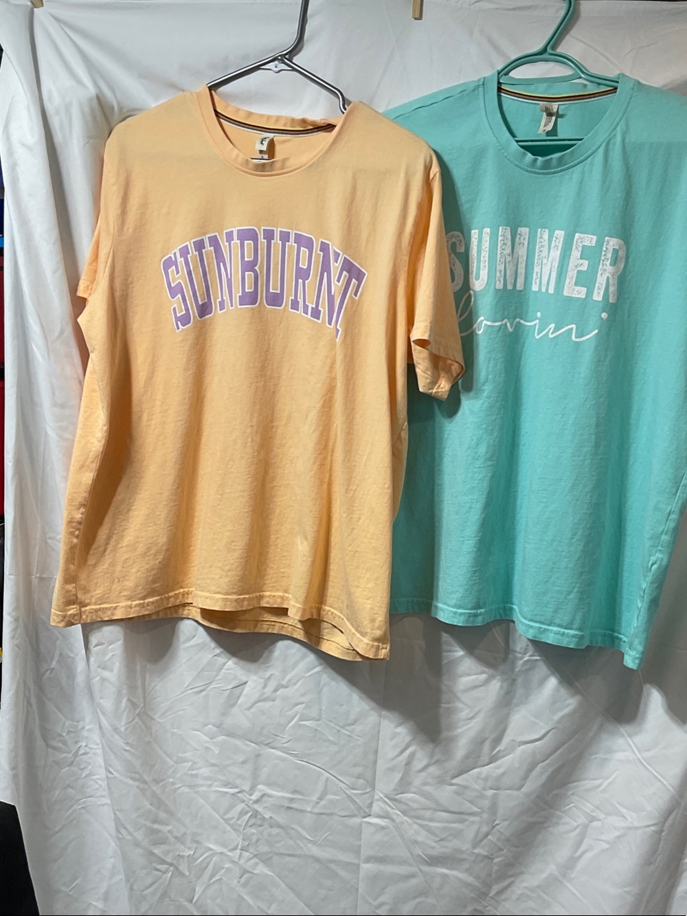 Ladies Graphic Tees. Turquoise won once. Peach never worn.